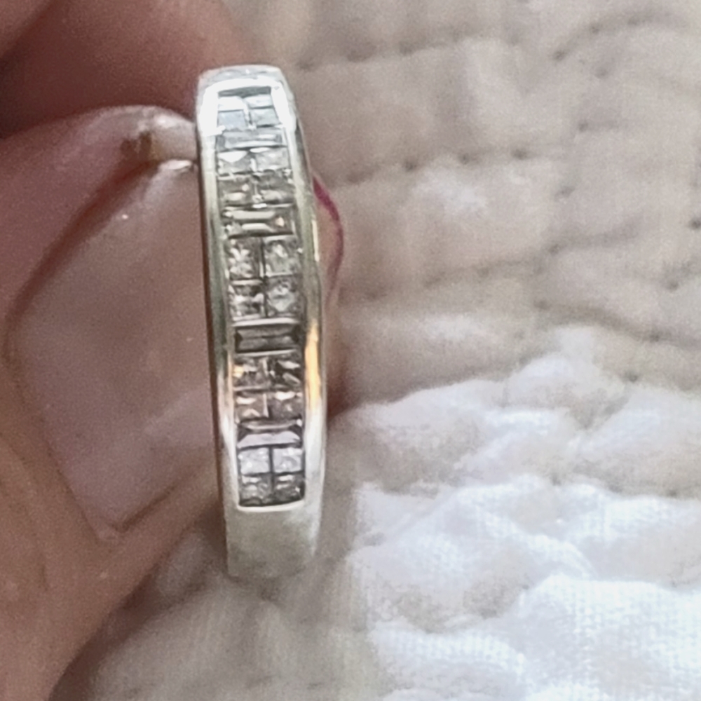 Women's white gold wedding band with baguettes.